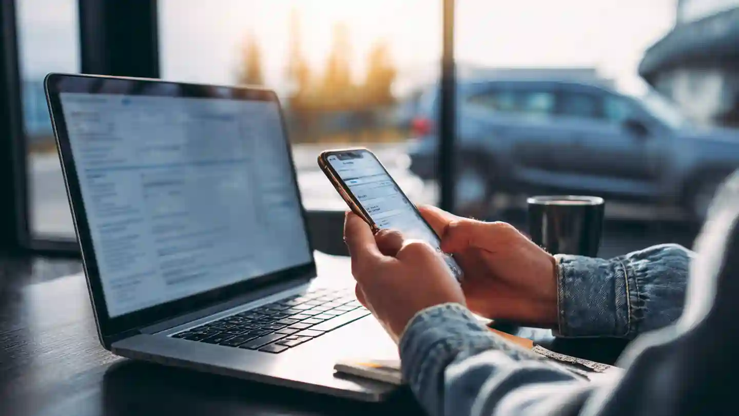 Person checking vehicle RC status online on laptop